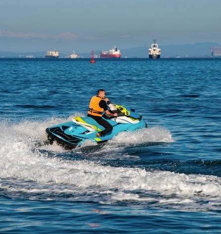 Guest riding a jet ski across open water near Fajardo, Puerto Rico.