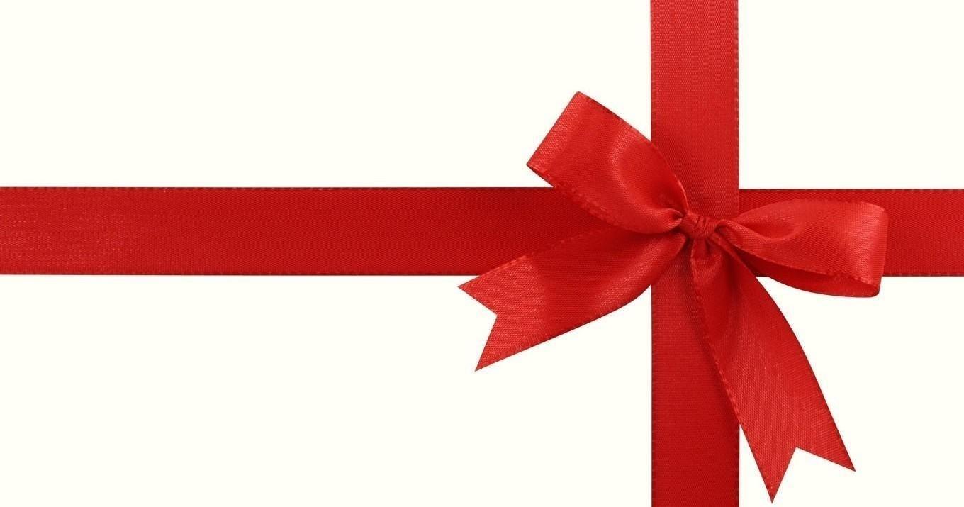 Red ribbon tied in a bow on white background.