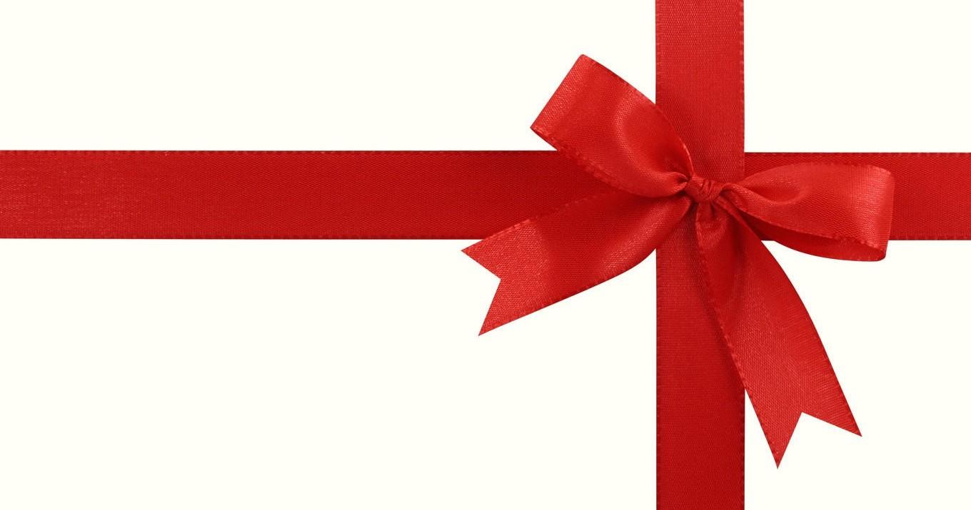 Red ribbon tied in a bow on a white background.