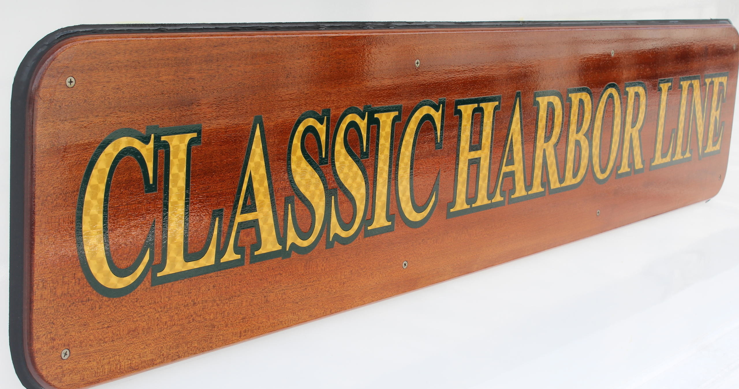Wooden sign with 'CLASSIC HARBOR LINE' in yellow lettering.
