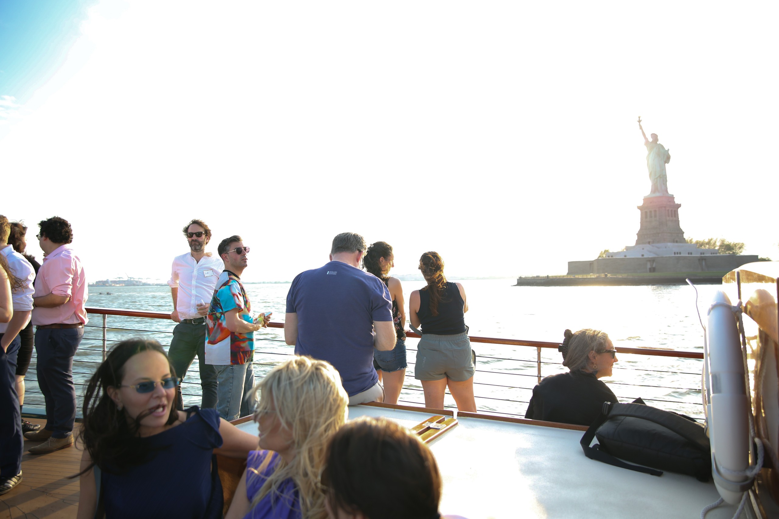People on a boat near the Statue of Liberty.